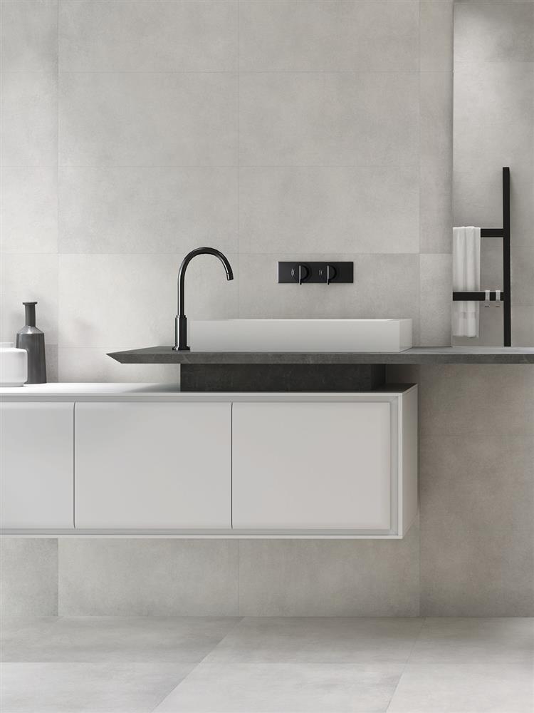 Industrial minimalist bathroom with grey concrete tiles